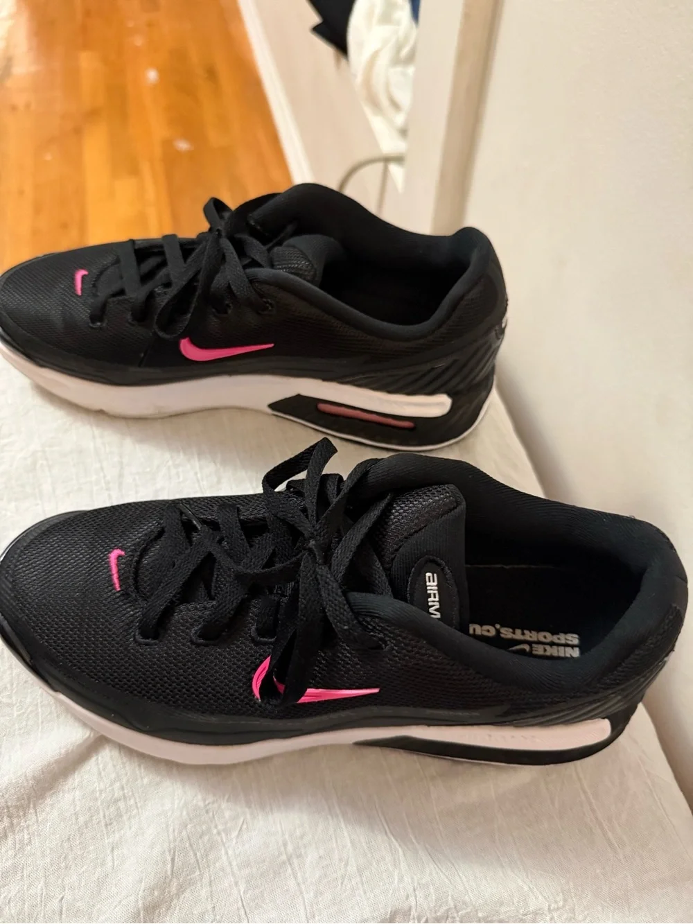 Nike Women's Black Athletic Shoes with Pink Swoosh
